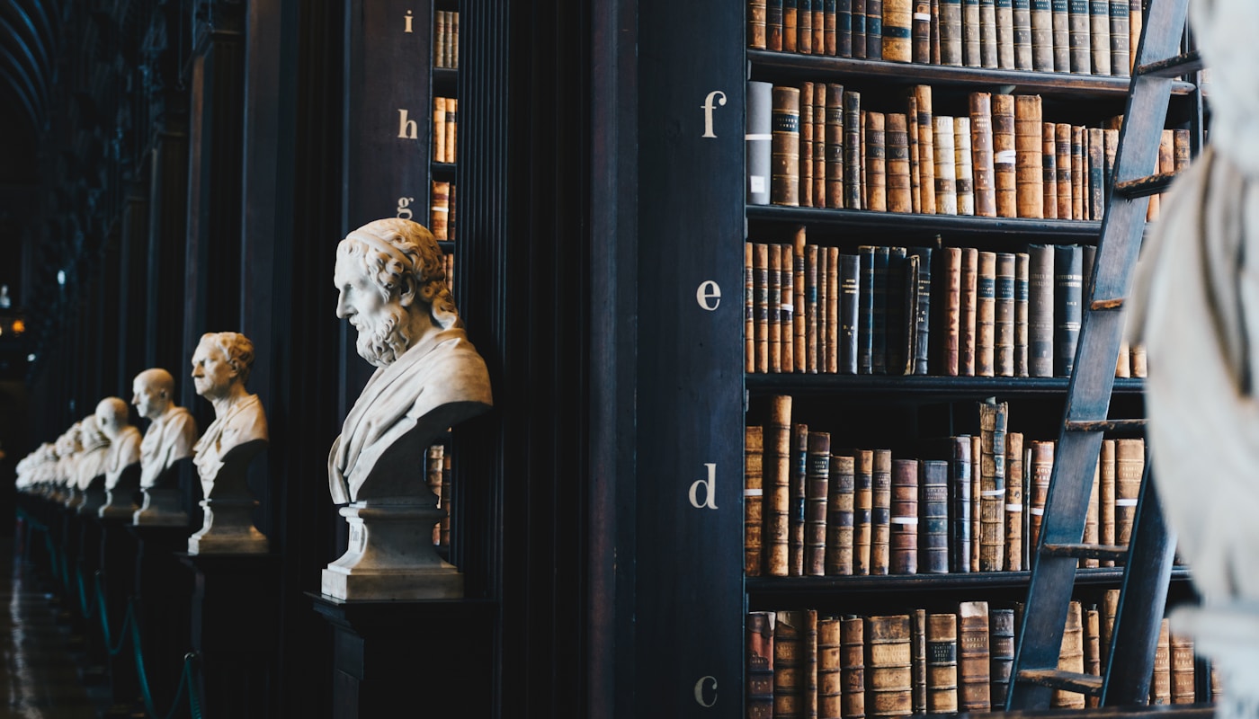 Legal library with classical busts and law books